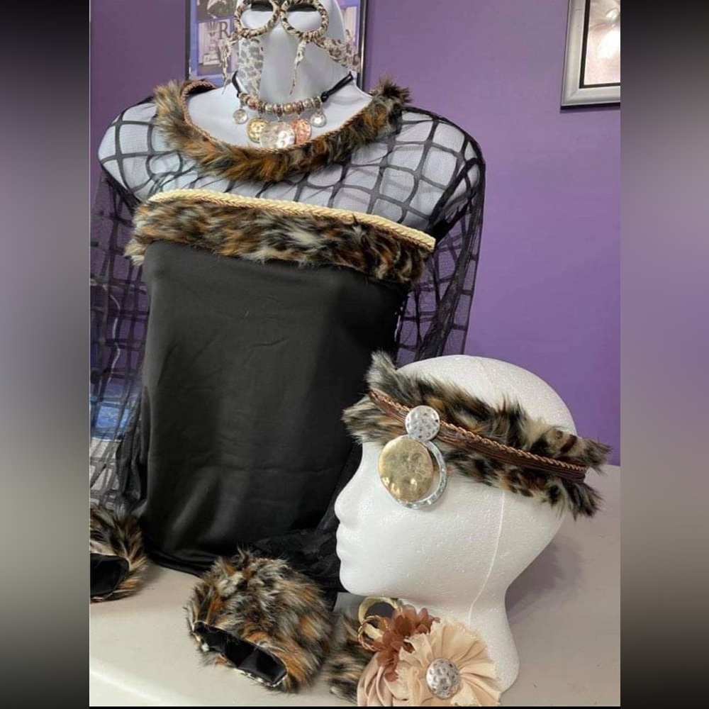AS long sleeve black top with leopard fur trim and several matching accessories